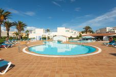 Apartamento en Corralejo - Apartamento, terraza, piscina, primera línea de playa en Corralejo - Home For Guest